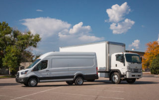 Chevy box truck and Ford Transit by Lightning eMotors