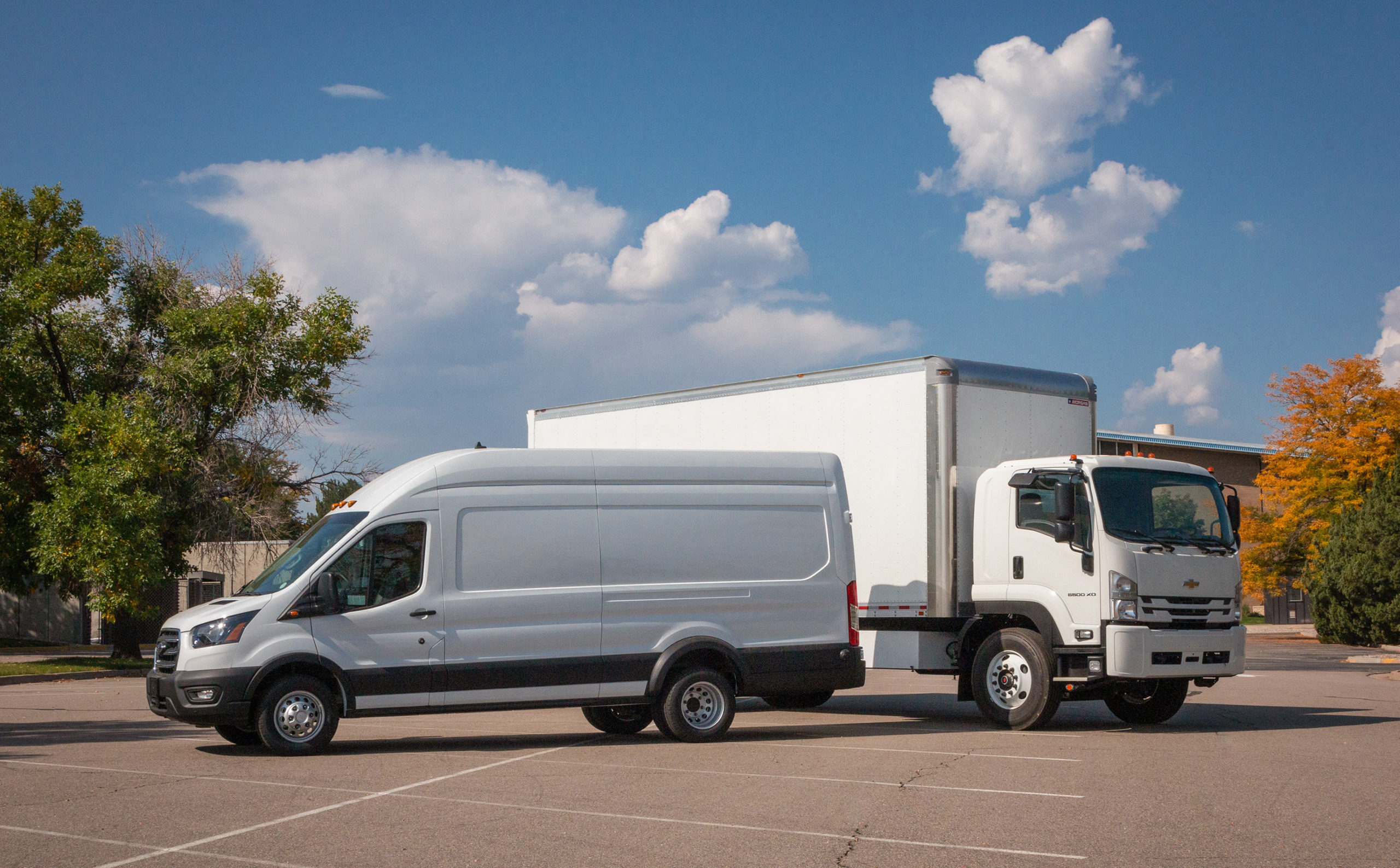 Chevy box truck and Ford Transit by Lightning eMotors